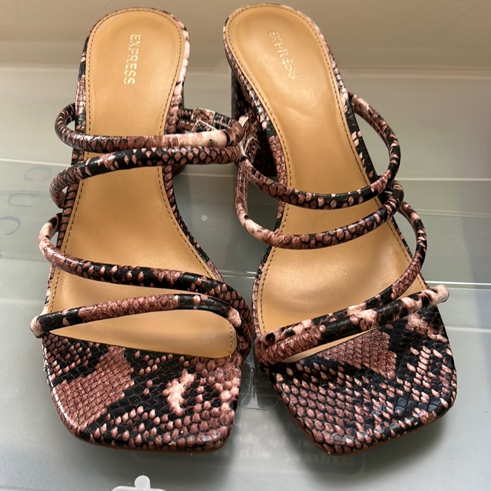 Gently worn express snake skin heel